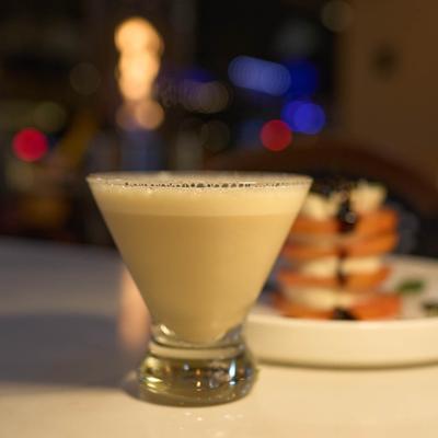 Creamy cocktail served in a martini glass.