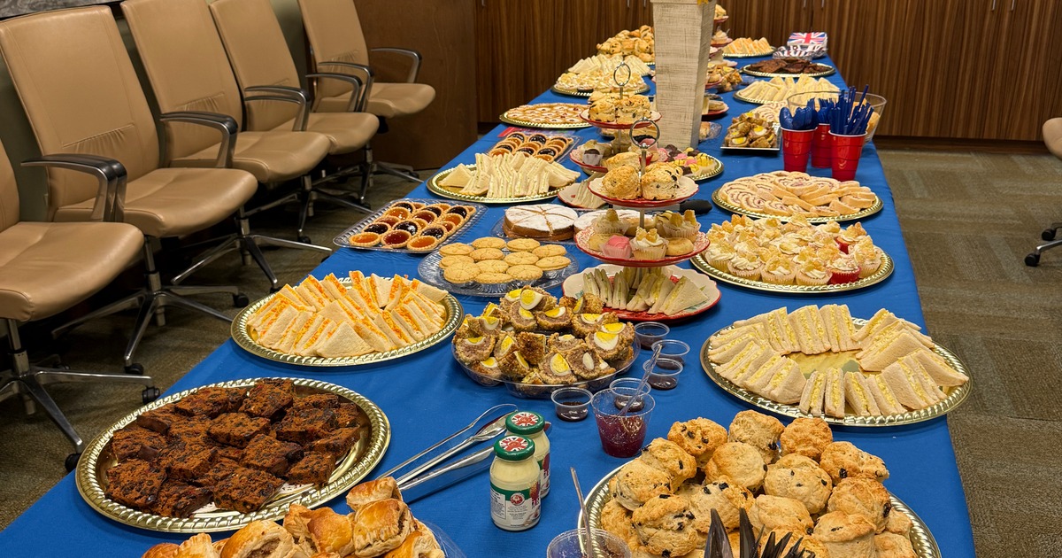 Large catering spread featuring a variety of tea-time and finger-food items