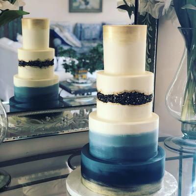 Blue and white four tier cake