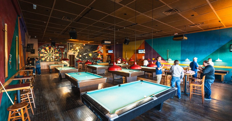 Interior, billiard room, pool tables, dart dash behind