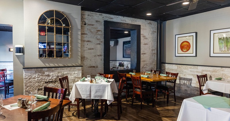 Interior, set dining tables ready to receive guests