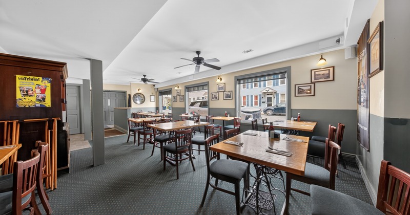 Interior, bright dining area with art on walls