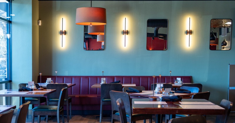 Interior, tables, chairs and red leather seating