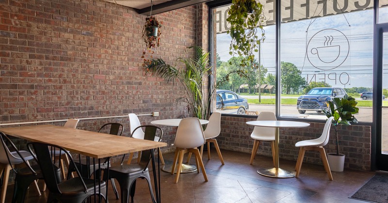 Interior, tables and chairs near wall