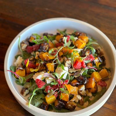 Fall Salad, arugula, roasted butternut squash, pomegranate, feta, candied walnut, white balsamic vinaigrette.