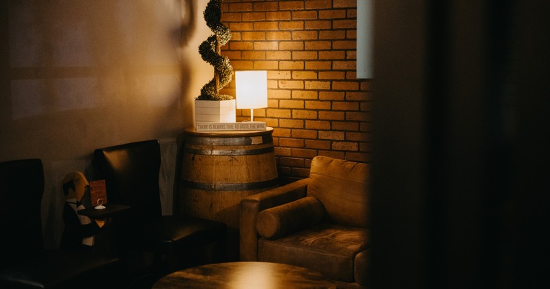 Detail of a cozy corner, couch and a lamp