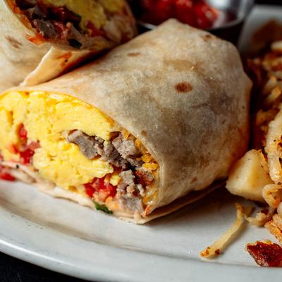 Breakfast Burrito, with scrambled eggs, sausage, cheddar, and pico de gallo.