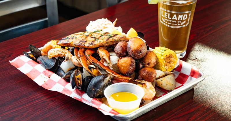 Blackened Seafood Boil served  with a glass of beer