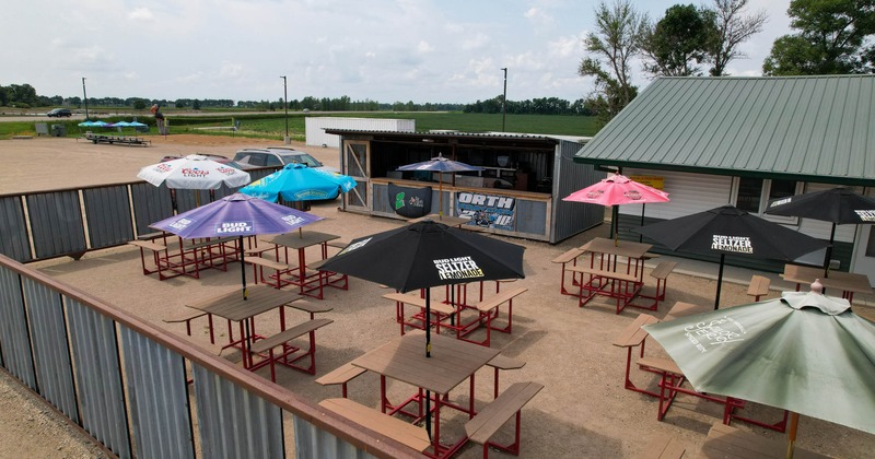 Exterior, tables and chairs with parasols on the outside