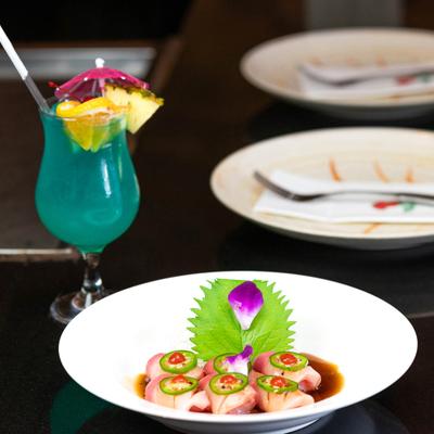 Sliced yellowtail, with jalapenos and ponzu sauce.