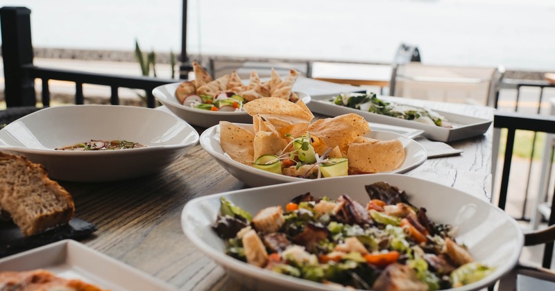 Variety of dishes served on the table featuring open-air seating