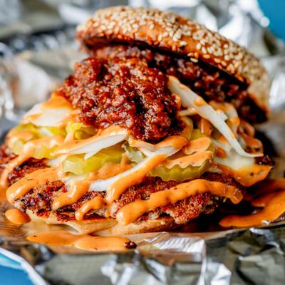 Smash burger topped with a rich chili sauce, pickles and a creamy coleslaw.