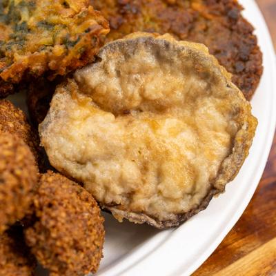 Mama's Mix Platter with falafel, eggplant and latke, close-up.