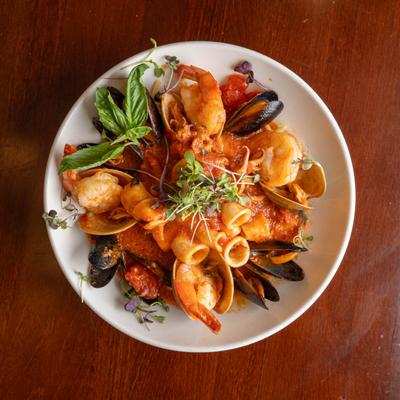 Jumbo shrimp, clams, mussels, and calamari plate, top view.