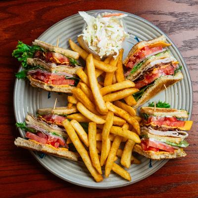 Turkey Ham club with fries and coleslaw.