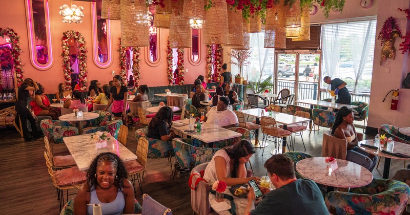 Lively and spacious interior dining area full of guests