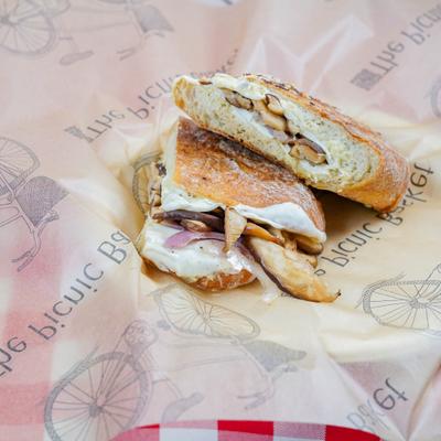 Shiitake Melt sandwich with mozzarella, sautéed red onion and artichoke paste.
