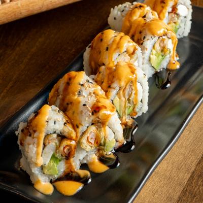 Aloha Roll garnished with spicy mayo and eel sauce.