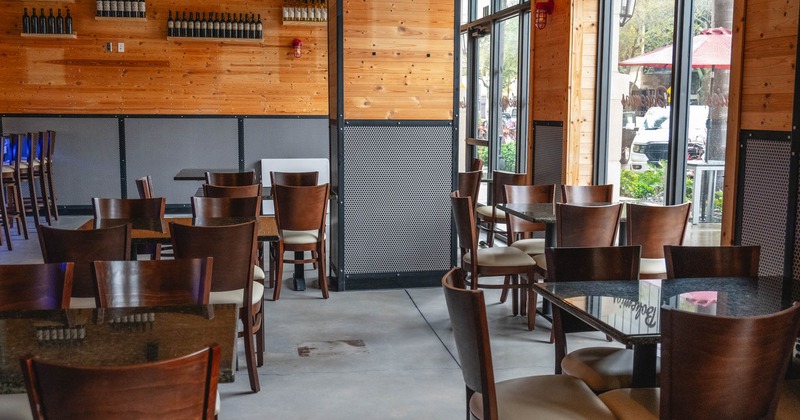 Interior, seating by the windows, tables and chairs