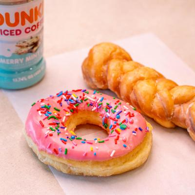 Pink frosted sprinkle donut.