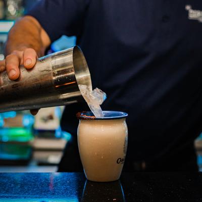 A person preparing a drink.