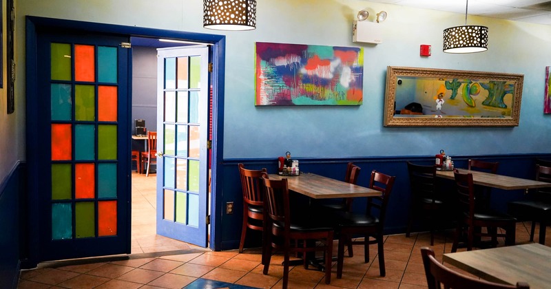 Interior, seating area with tables ready for guests