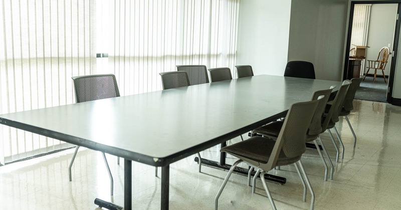 Interior, conference table for twelve, back room entrance, marble tile flooring