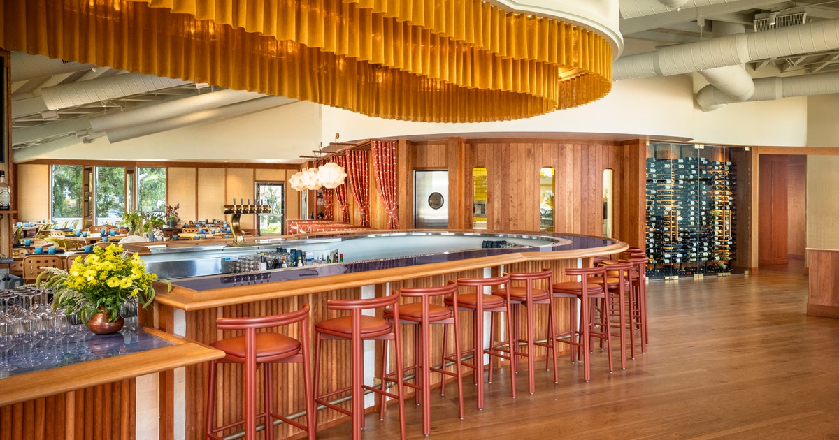 Spacious and cozy interior dining area with set tables ready for guests