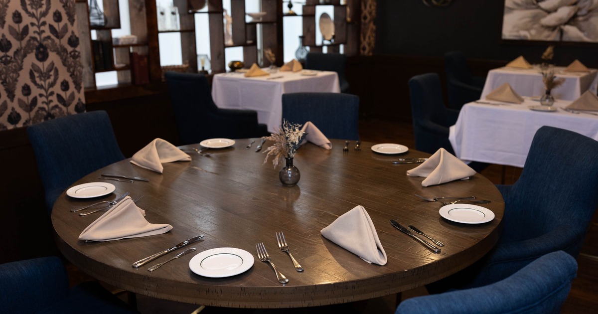 Interior, a round table with tableware ready for guests