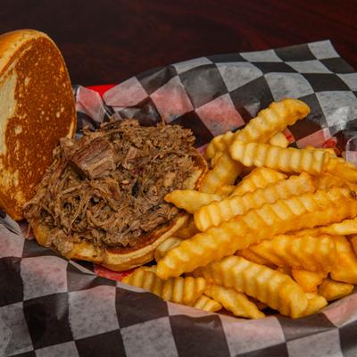 Brisket sandwich with fries.