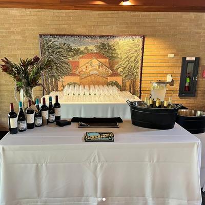 Interior, a table with wine selection and wine glasses.