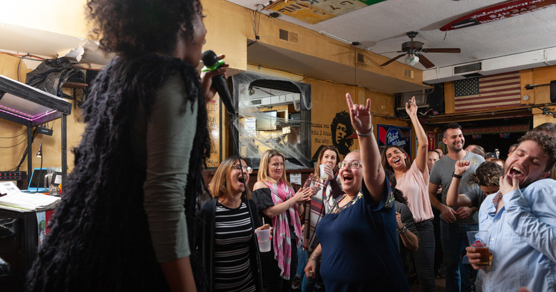 Guests singing together with a singer