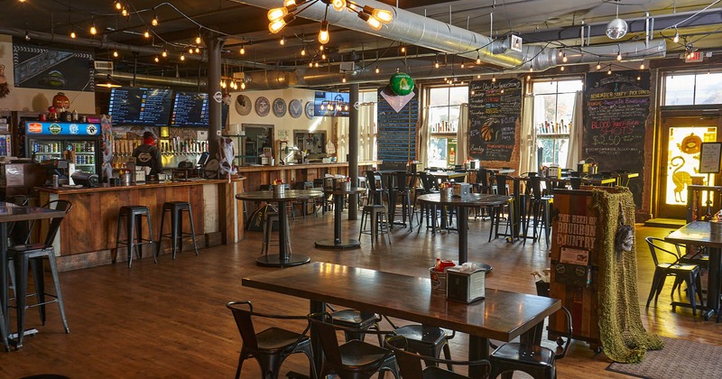 Interior, tables, chairs, counter, chock boards with menus, pirate-style decorations