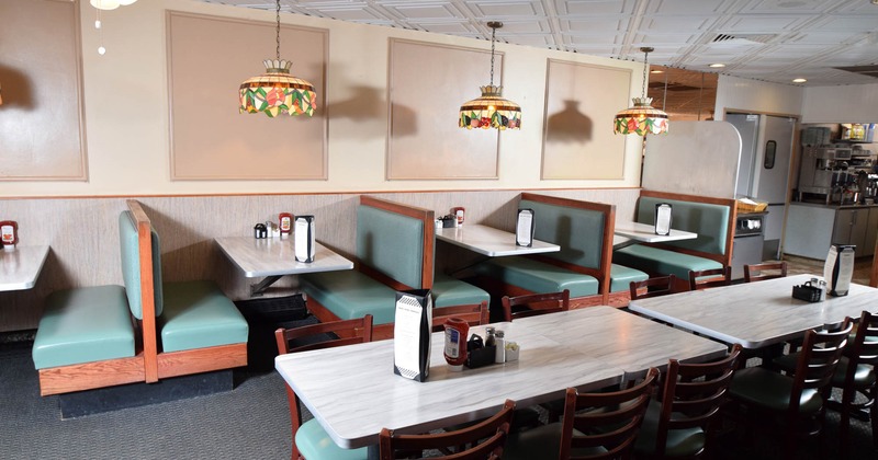 Interior, dining area, regular tables and seating booths, ready for guests, chandeliers