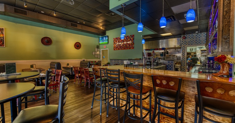 Cozy restaurant interior, dining area and bar