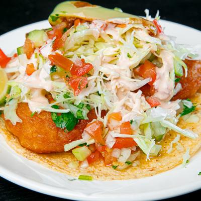 Fish Taco, with cabbage, salsa, and chipotle sauce.