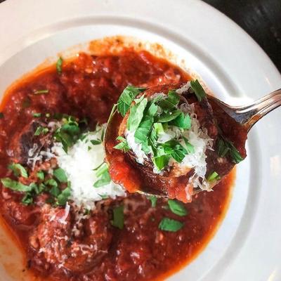 Lamb meatballs in spicy tomato sauce.