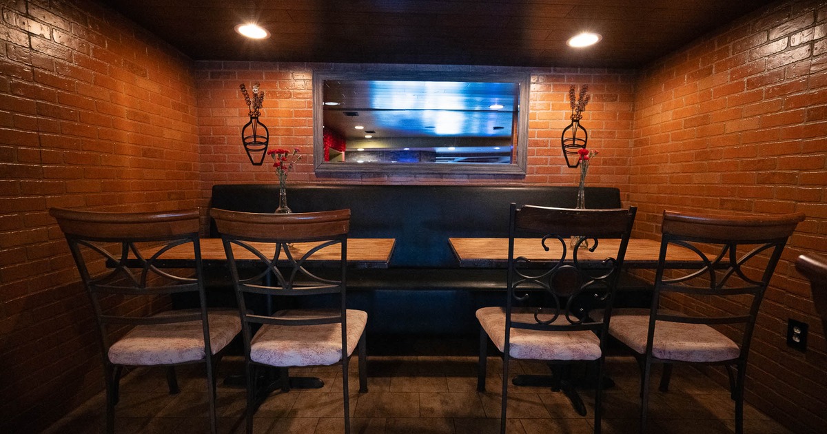 Interior, dining area with two tables