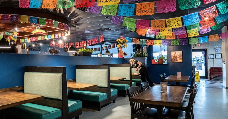 Mexican style interior design, dining area, tables, chairs and dining booths
