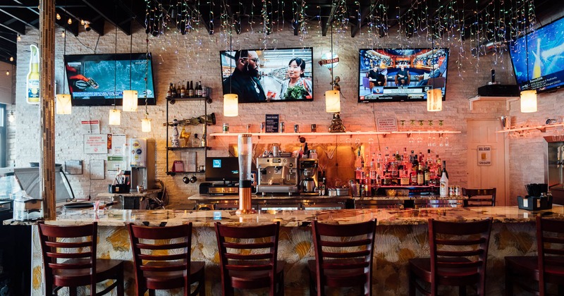 Interior, bar counter, big TVs on the wall