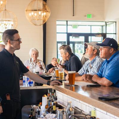 Interior, customers sitting at the bar.