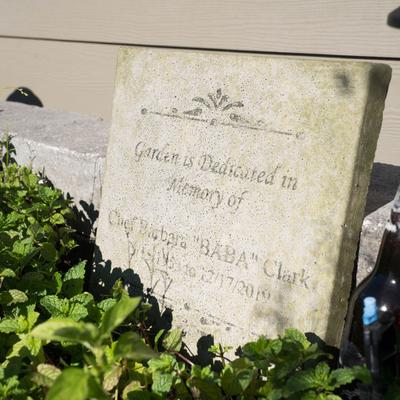 A stone memorial tablet in the garden.