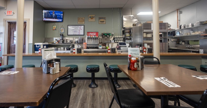 Interior, seating area with an ordering counter in the back