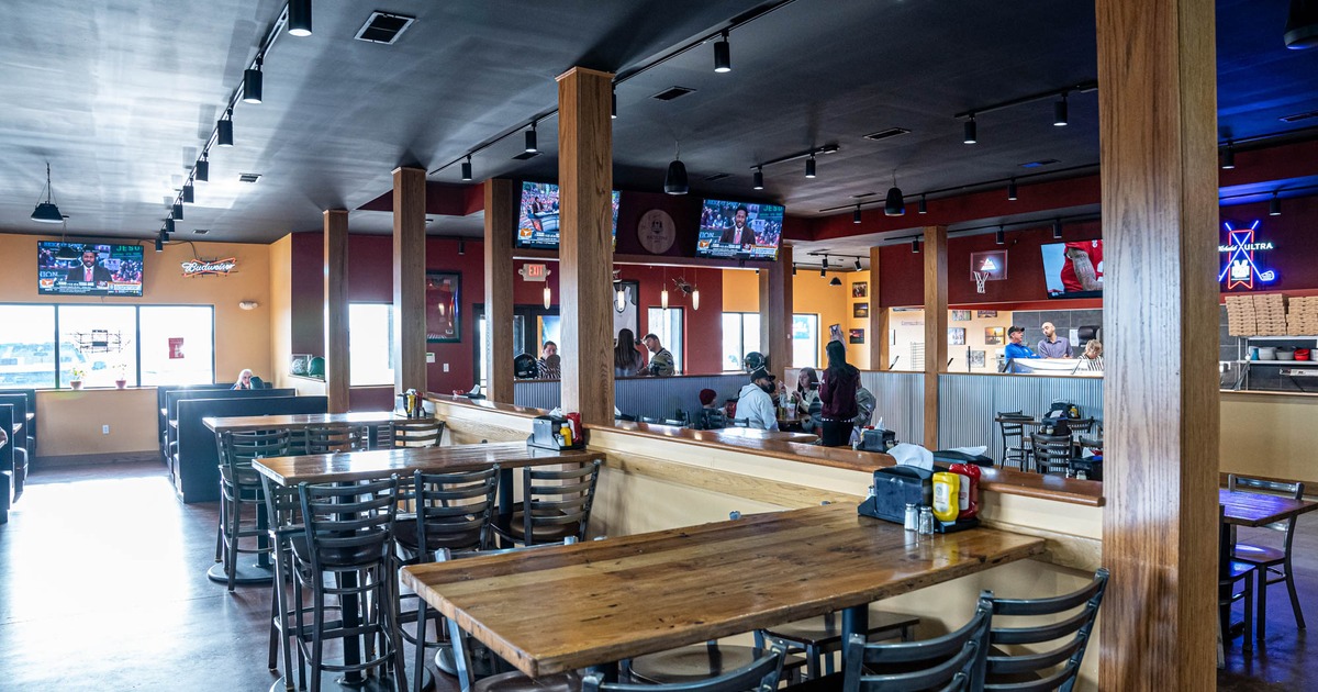 Inside, tables, chairs, TVs, customers