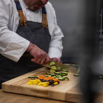 The chef cutting vegetables.