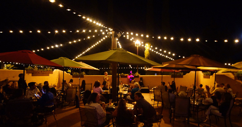 Exterior, crowded seating area, nighttime