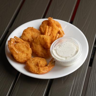 Fried Jumbo Shrimp served with a side of dipping sauce.