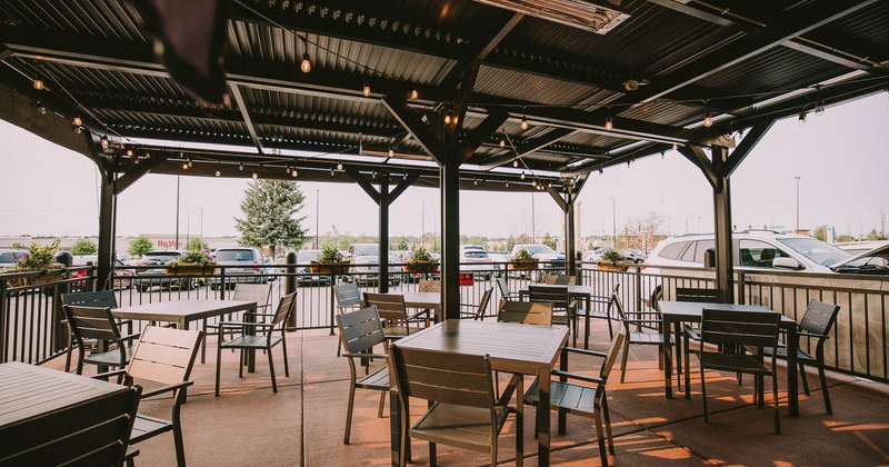 Exterior, patio with tables and chairs ready for guests