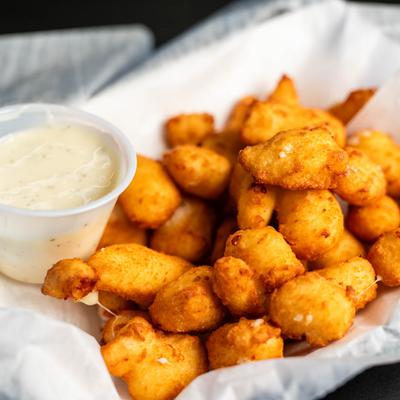 Cheddar cheese curds, close-up.