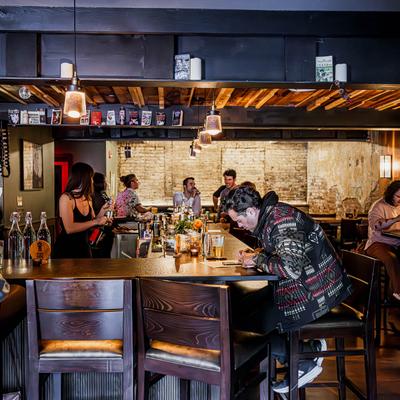 Bar area, customers sitting at the counter.